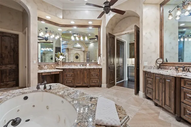 a large bathroom with a tub sink shower and mirror