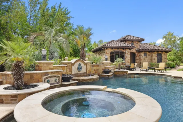 a view of a swimming pool with a patio