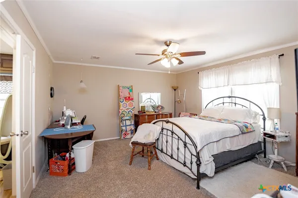 a bedroom with a bed and a table in it