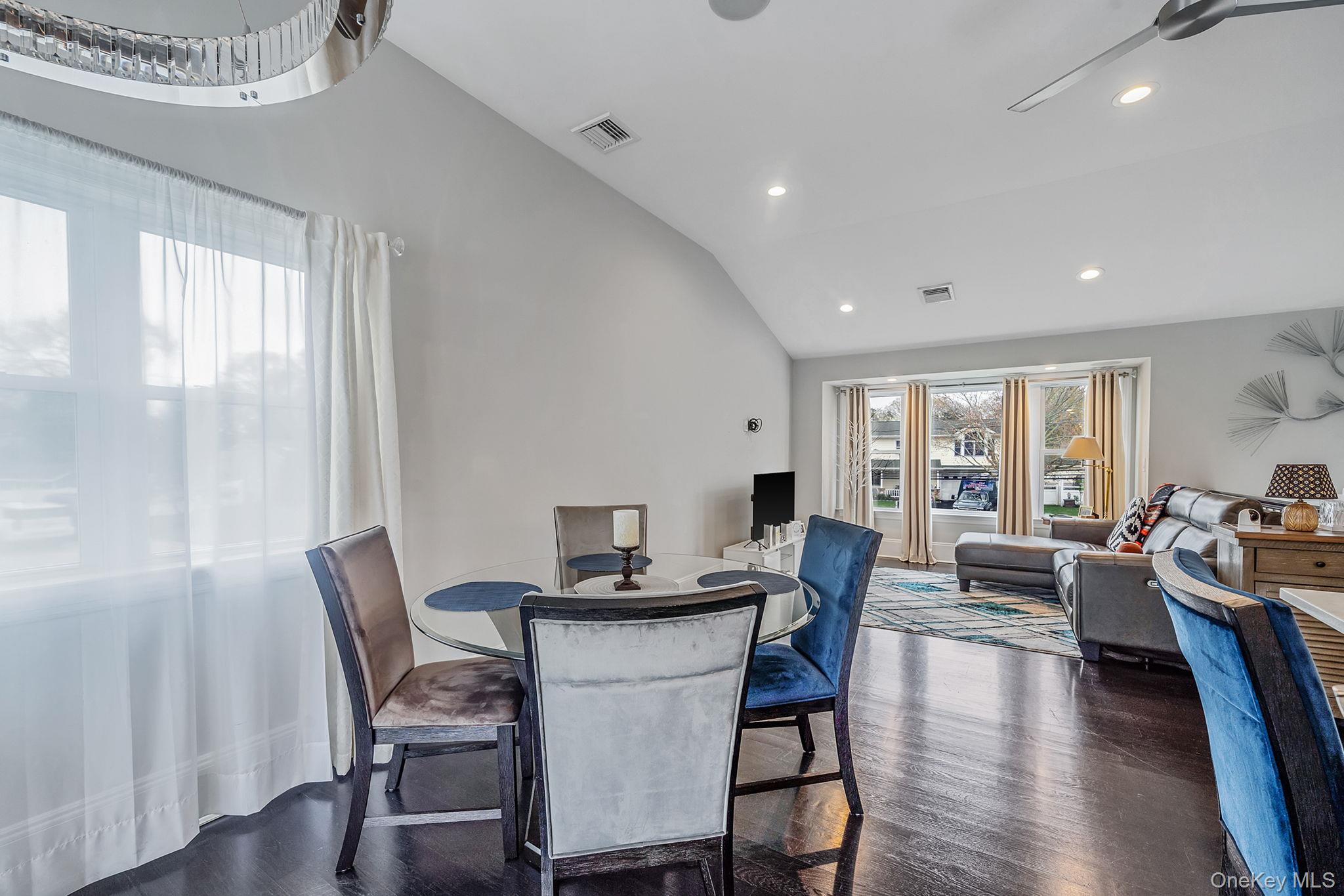110 Stephen Road Bayport, NY 11705 - Photo 21 of 39 a view of a dining room with furniture window and wooden floor