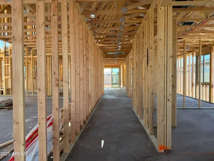 a view of a hallway with a door and stairs