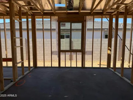 a view of an empty room and a balcony
