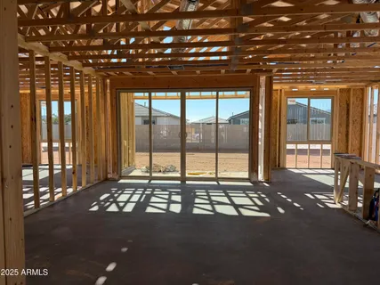 a view of a room with furniture and floor to ceiling window