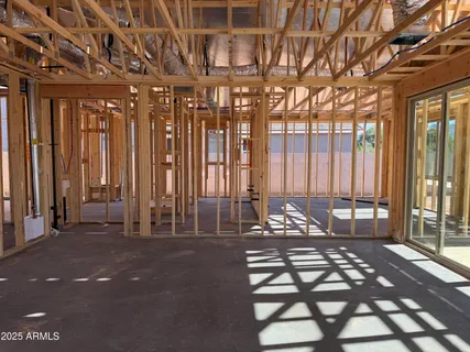 a view of an empty room with windows