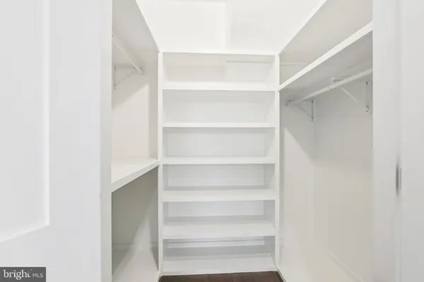 a view of a hallway with a white walls