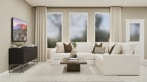 a living room with furniture and a lamp