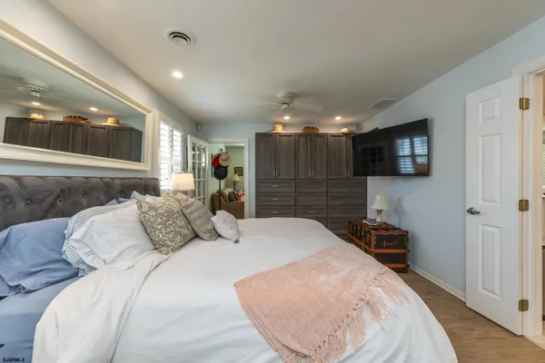 a bed room with a bed and a television