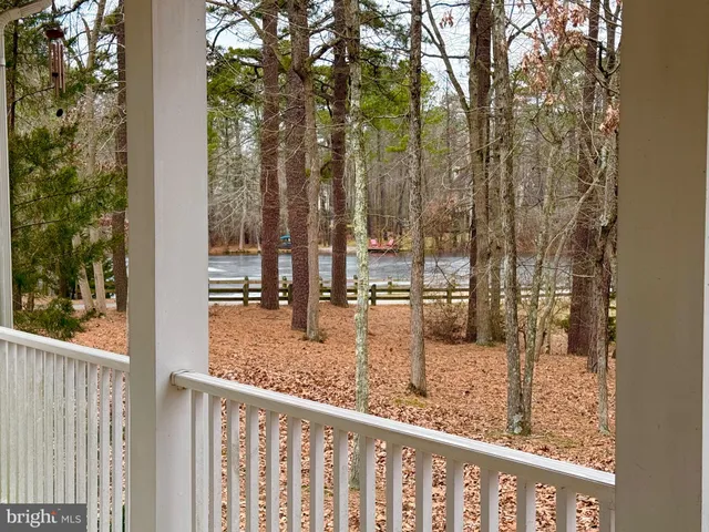 a view of a glass top table and chairs