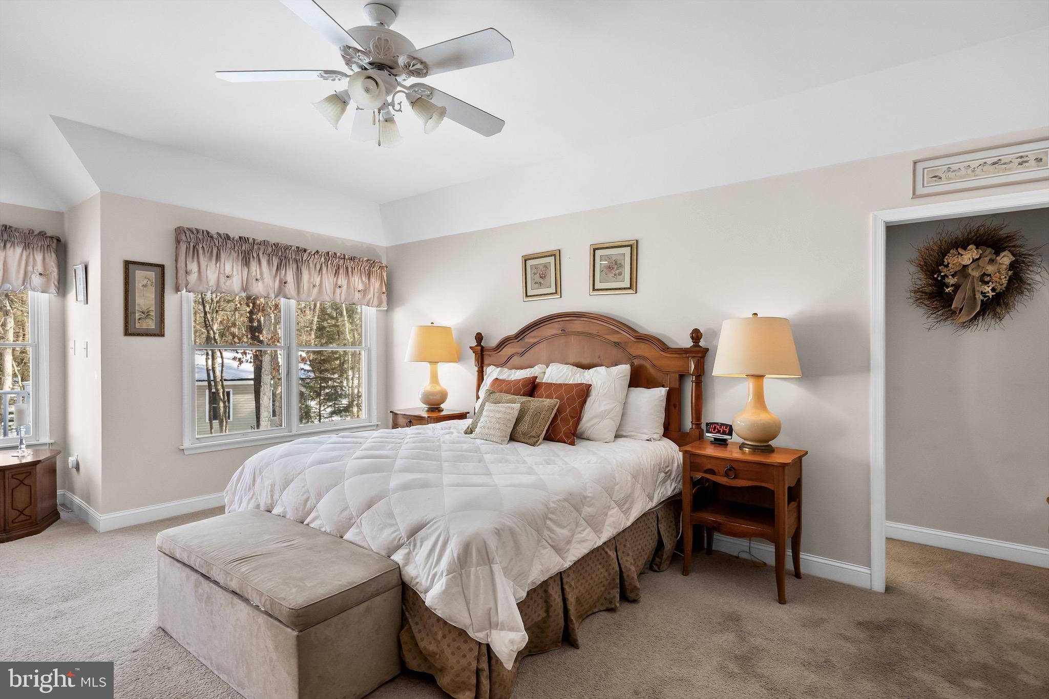19 Big Look Trail Medford, NJ 08055 - Photo 22 of 61 a bedroom with a bed and a chandelier