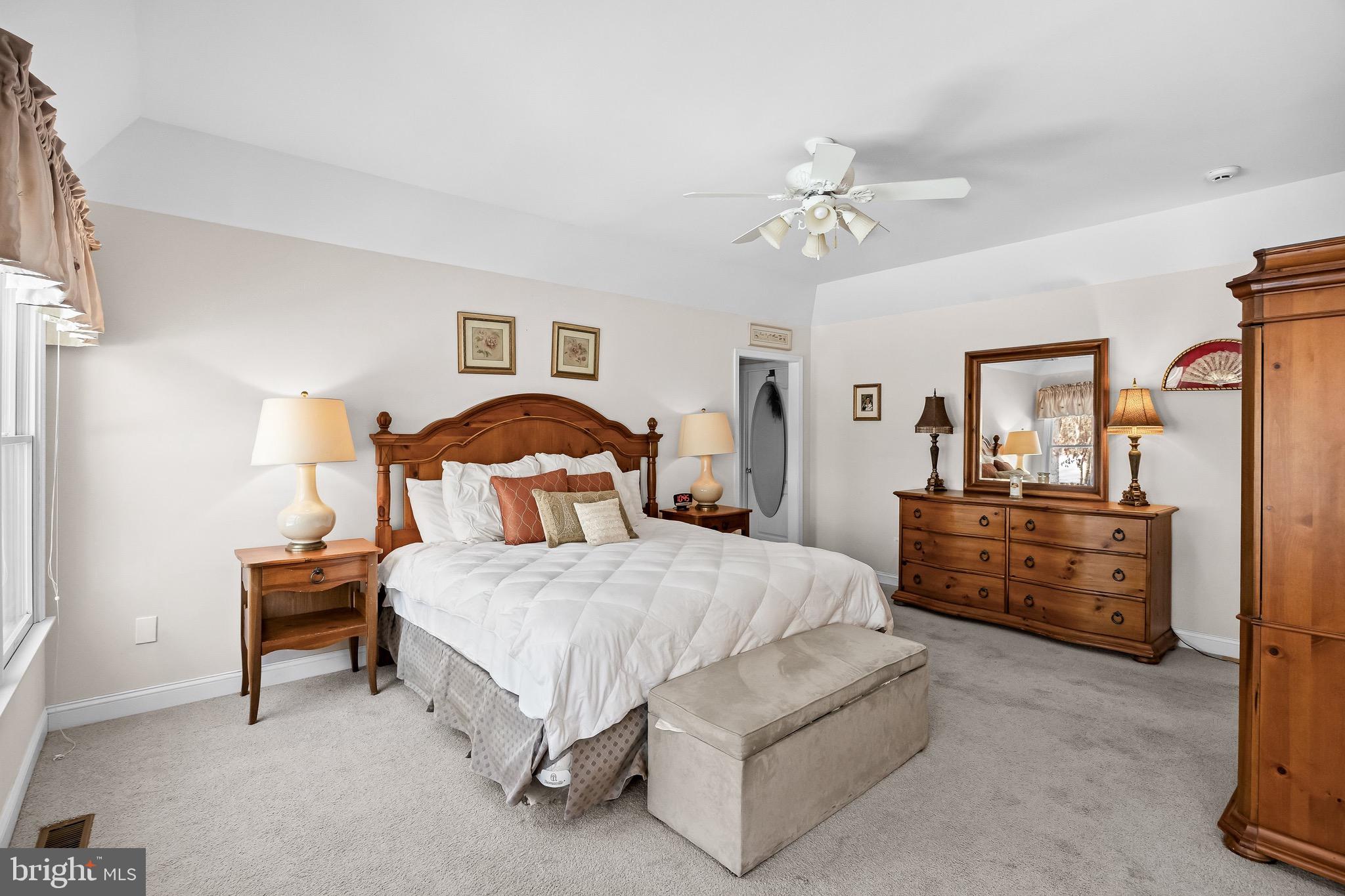 19 Big Look Trail Medford, NJ 08055 - Photo 23 of 61 a bedroom with a bed and a chandelier