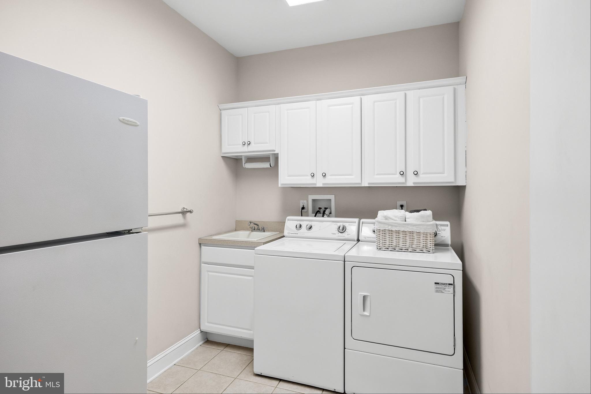 19 Big Look Trail Medford, NJ 08055 - Photo 26 of 61 a view of washer and dryer with kitchen countertops