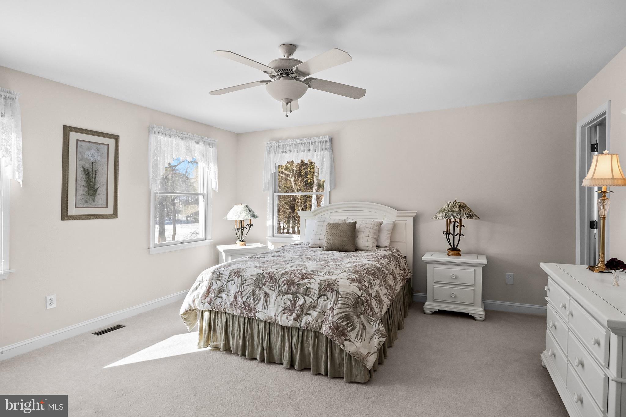 19 Big Look Trail Medford, NJ 08055 - Photo 29 of 61 a bedroom with a bed and a chandelier