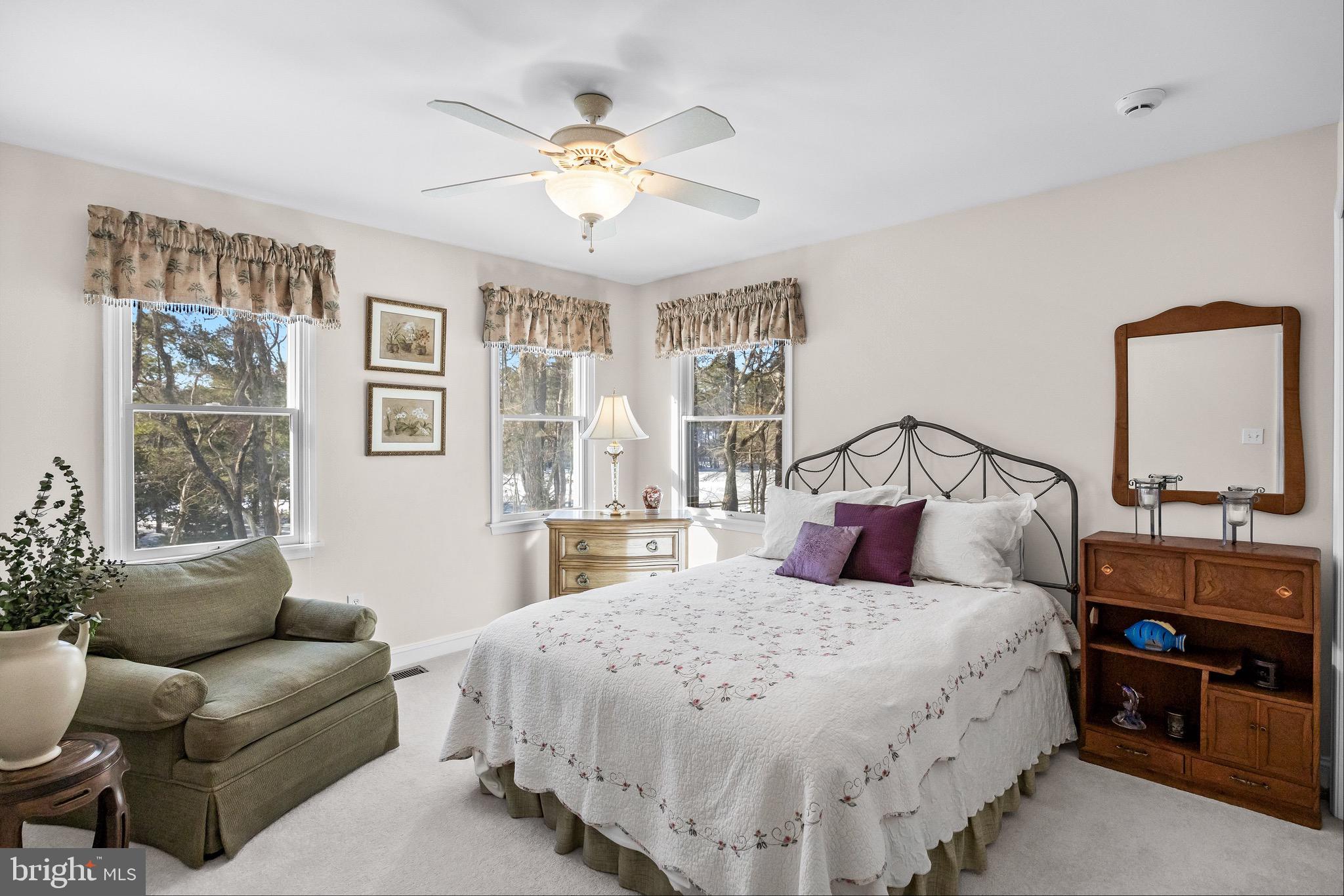 19 Big Look Trail Medford, NJ 08055 - Photo 32 of 61 a bedroom with a bed a couch and dresser