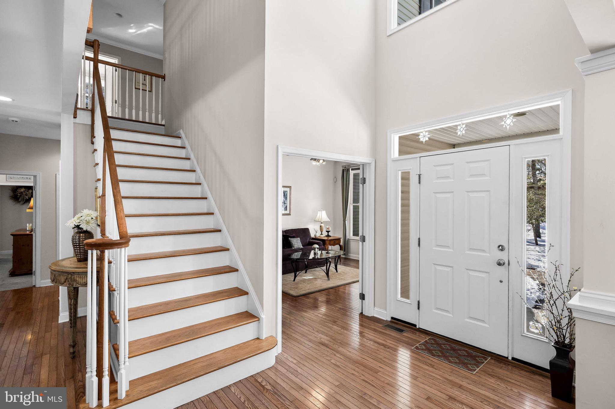 19 Big Look Trail Medford, NJ 08055 - Photo 10 of 61 a view of entryway with wooden floor and stairs