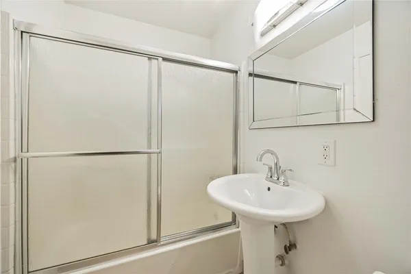a bathroom with a sink and mirror