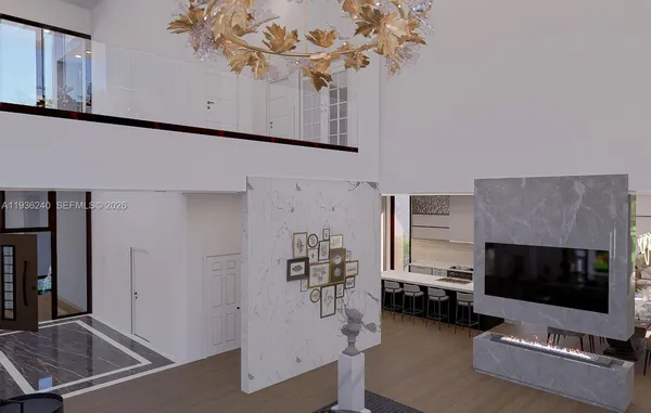 a living room with couches and kitchen view with wooden floor