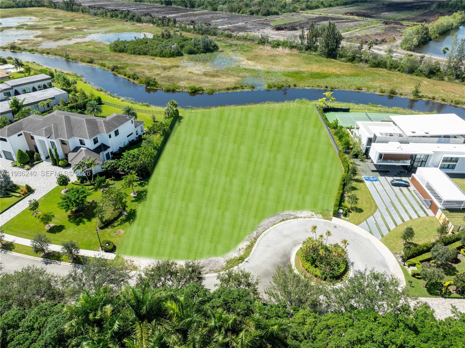 2757 Lake Ridge Lane Weston, FL 33332 - Photo 31 of 33 a view of a swimming pool with a garden
