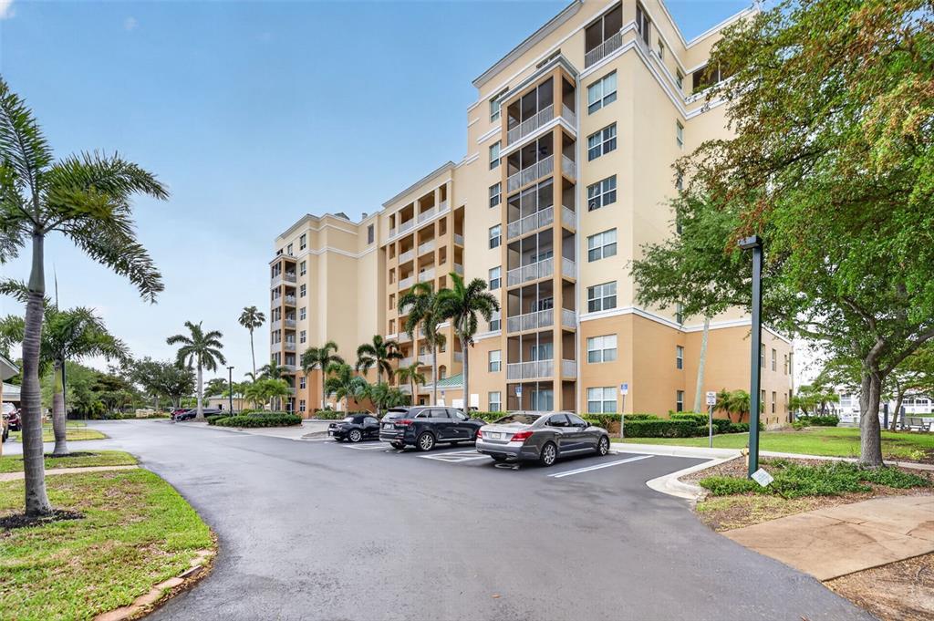 2060 Matecumbe Key Road, Unit 2506 Punta Gorda, FL 33955 - Photo 36 of 38 a car parked in front of a building with trees