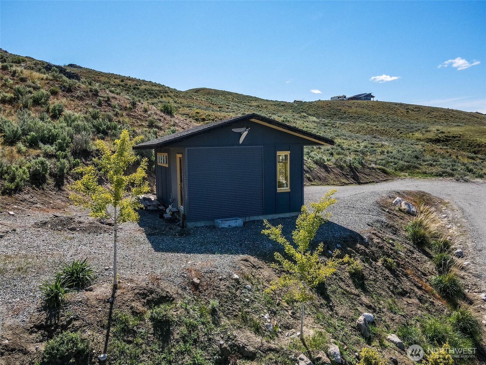 0 Plata Road Brewster, WA 98812 - Photo 14 of 28 a view of a wooden house with a yard
