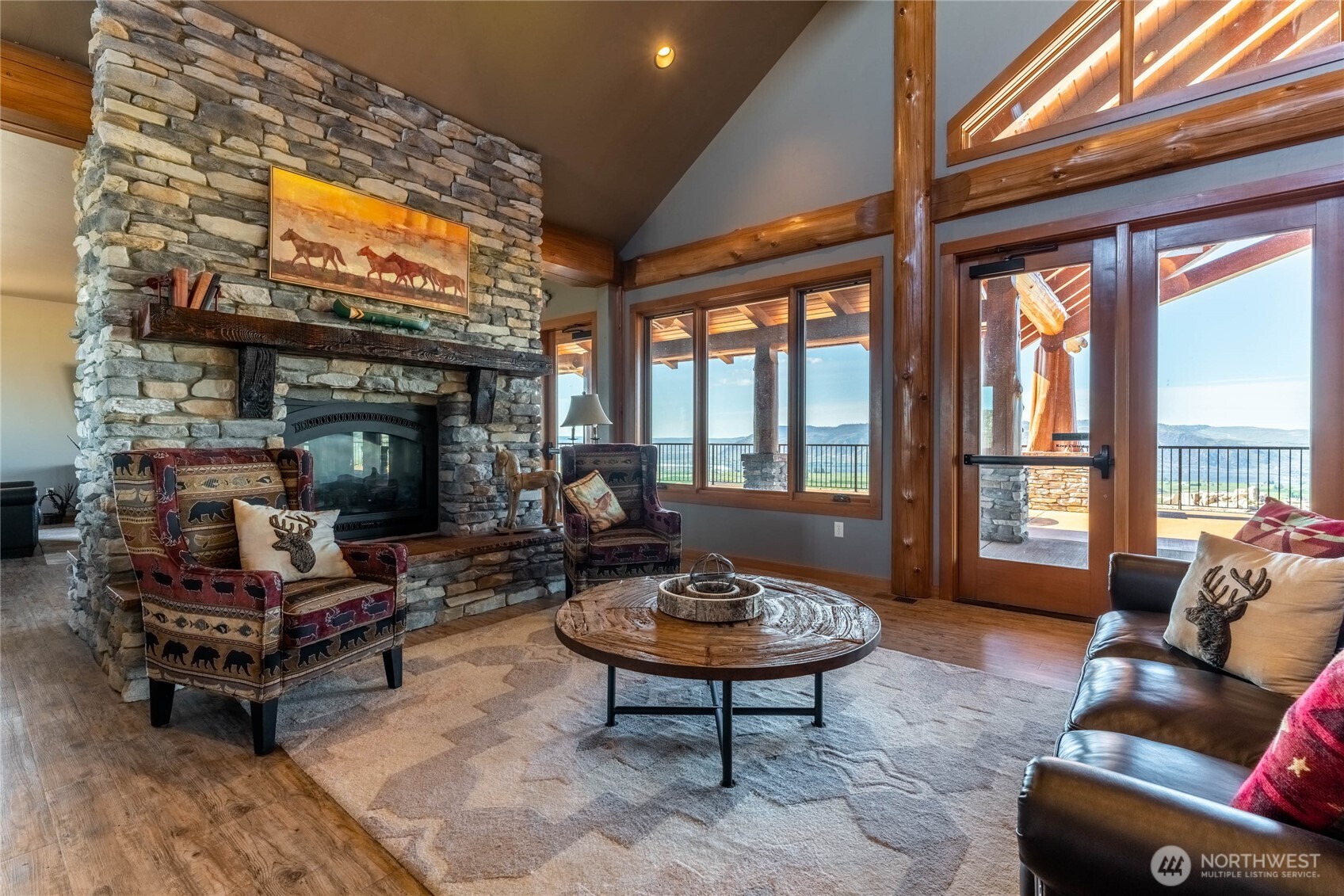 0 Plata Road Brewster, WA 98812 - Photo 21 of 28 a living room with furniture a fireplace and a large window