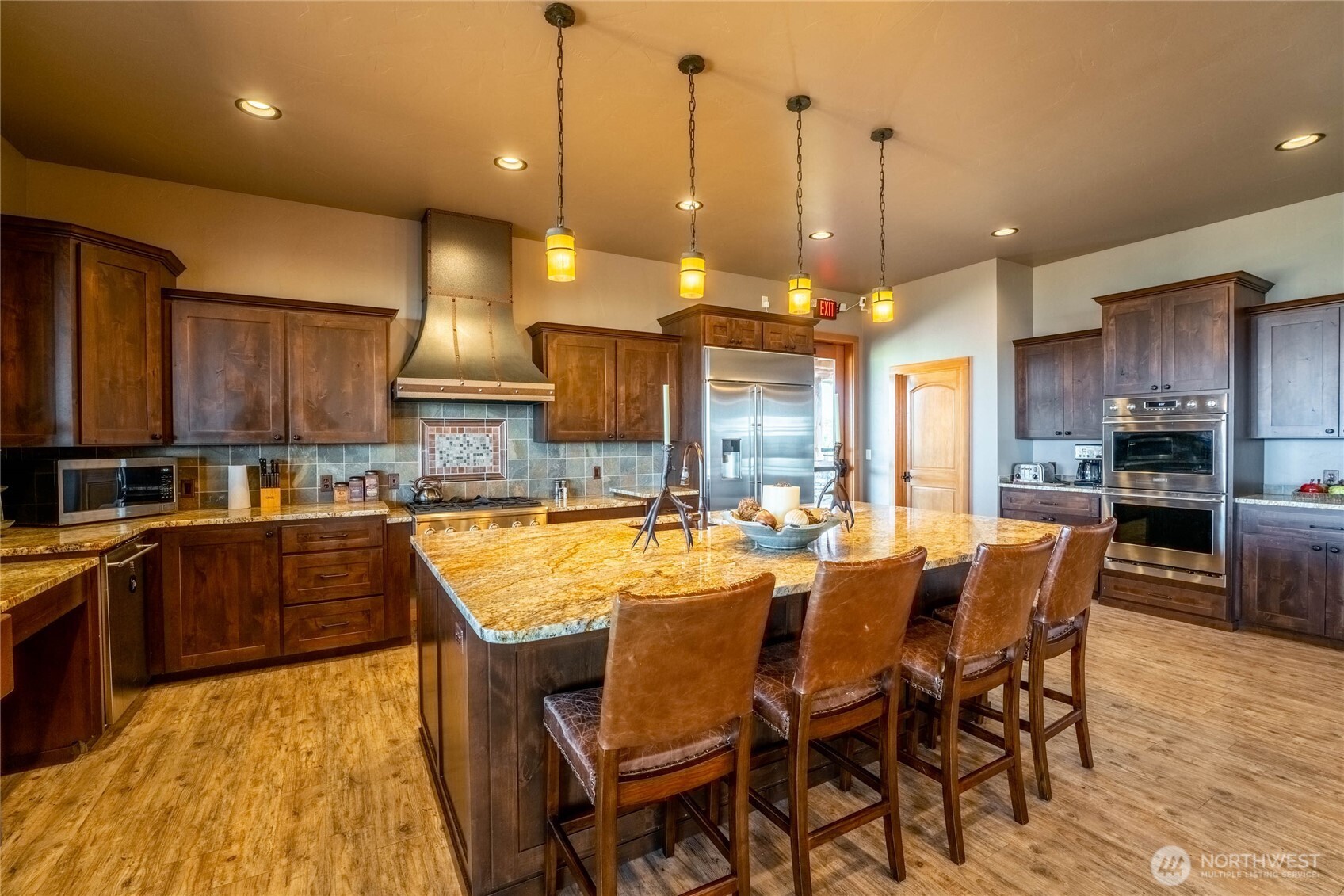 0 Plata Road Brewster, WA 98812 - Photo 22 of 28 a large kitchen with a table and chairs