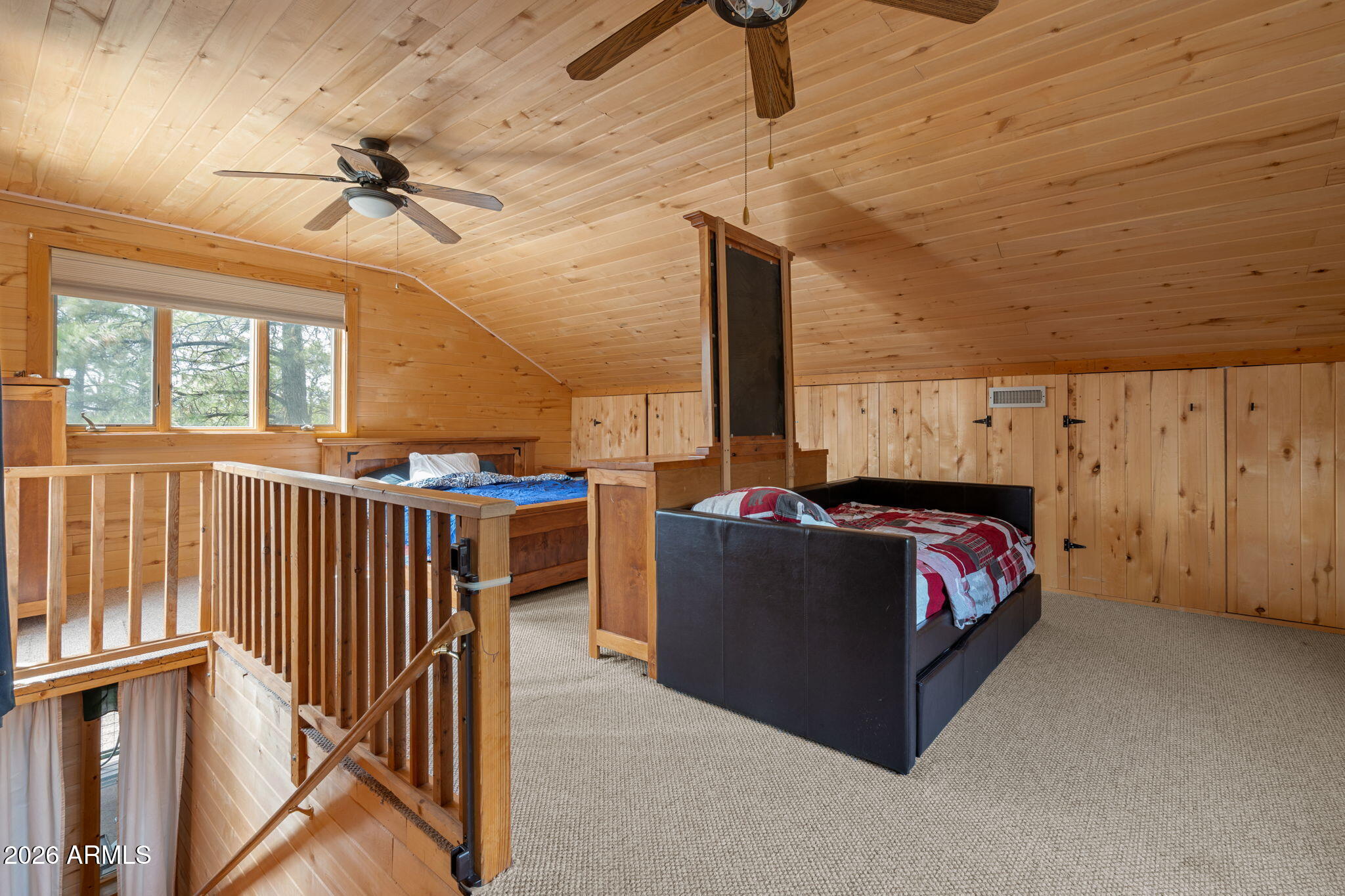 2095 Ranger Road Overgaard, AZ 85933 - Photo 13 of 25 a bed room with furniture and a window