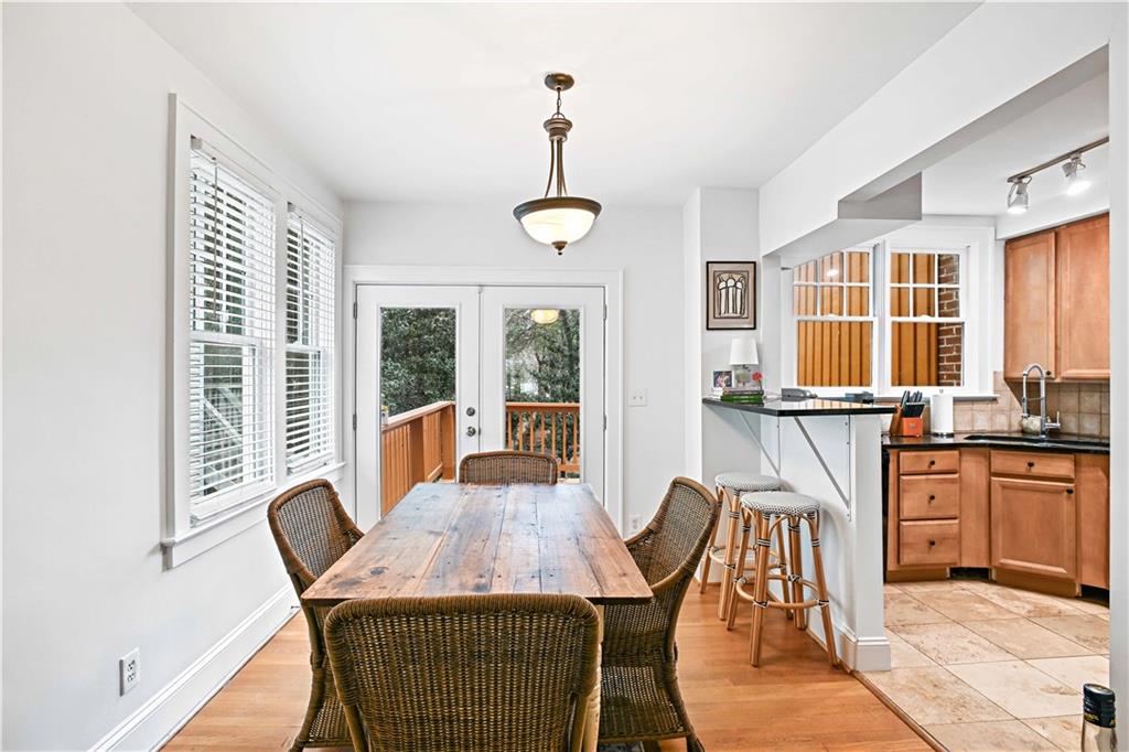 2188 Edison Avenue Northeast Atlanta, GA 30305 - Photo 12 of 51 a dining room with furniture a chandelier and wooden floor