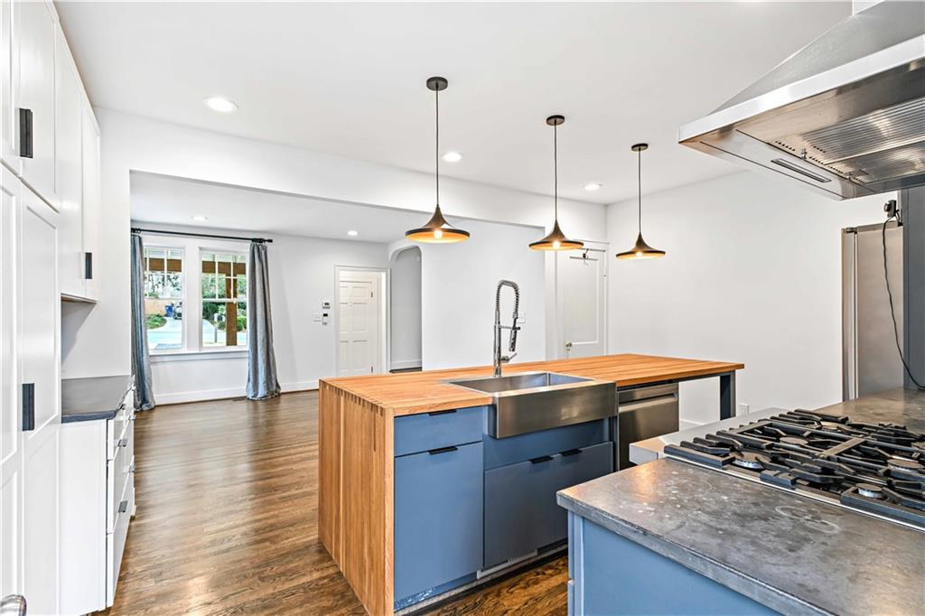 2188 Edison Avenue Northeast Atlanta, GA 30305 - Photo 17 of 51 a kitchen with a stove and a wooden floor