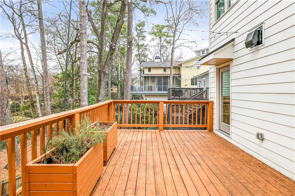 2188 Edison Avenue Northeast Atlanta, GA 30305 - Photo 46 of 51 a balcony with wooden floor and fence
