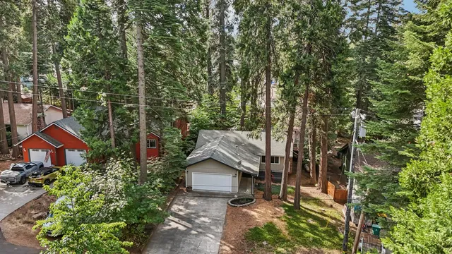 an aerial view of house with yard