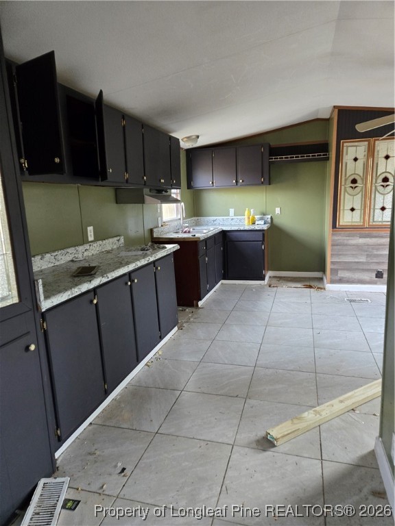 2222 Sand Hill Road Hope Mills, NC 28348 - Photo 4 of 12 a kitchen with stainless steel appliances granite countertop a sink and cabinets