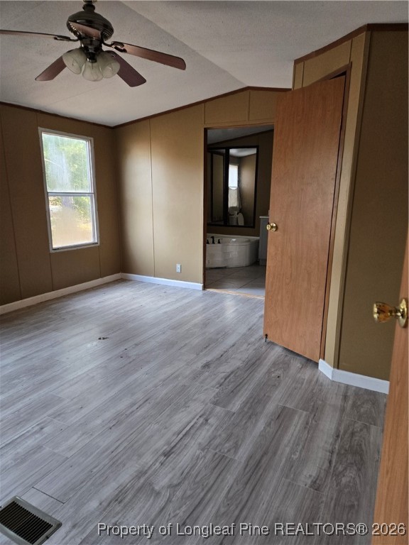 2222 Sand Hill Road Hope Mills, NC 28348 - Photo 5 of 12 wooden floor in an empty room with a window