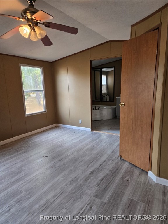 2222 Sand Hill Road Hope Mills, NC 28348 - Photo 9 of 12 a view of empty room with wooden floor and fan