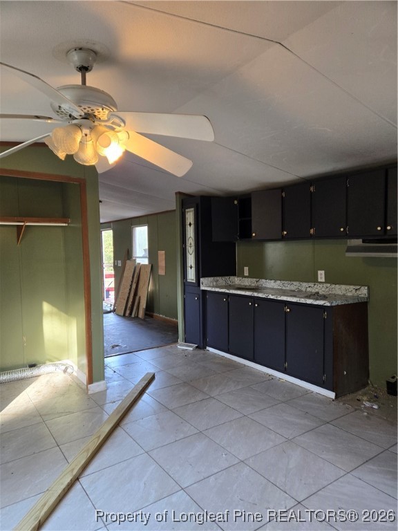 2222 Sand Hill Road Hope Mills, NC 28348 - Photo 10 of 12 a kitchen with granite countertop a stove and cabinets