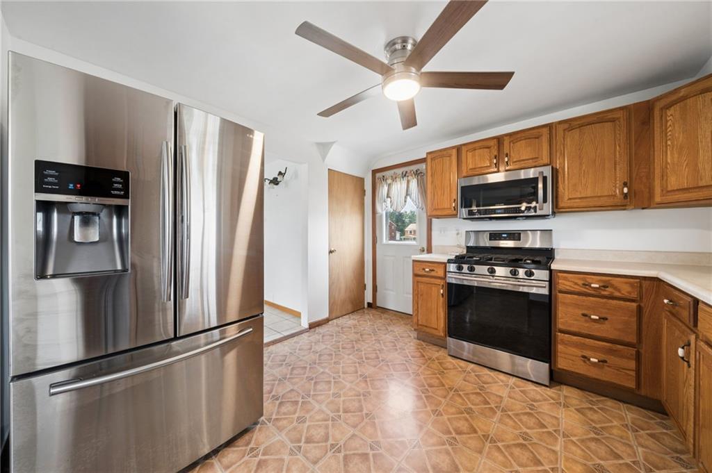 711 Jane Street Pittsburgh, PA 15239 - Photo 7 of 27 Another view featuring the stainless steel refrigerator
