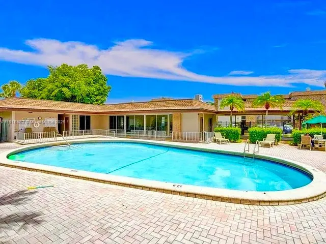 a view of a house with a swimming pool