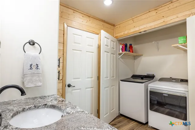 a bathroom with a sink and a washing machine