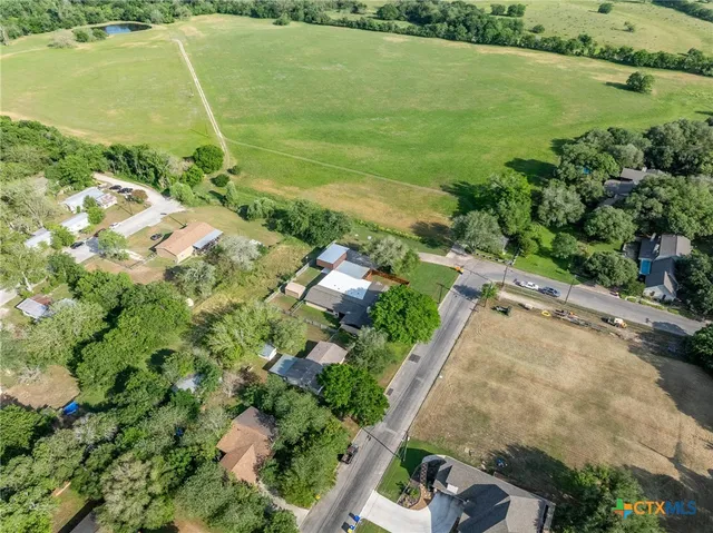 a view of a backyard with sitting area