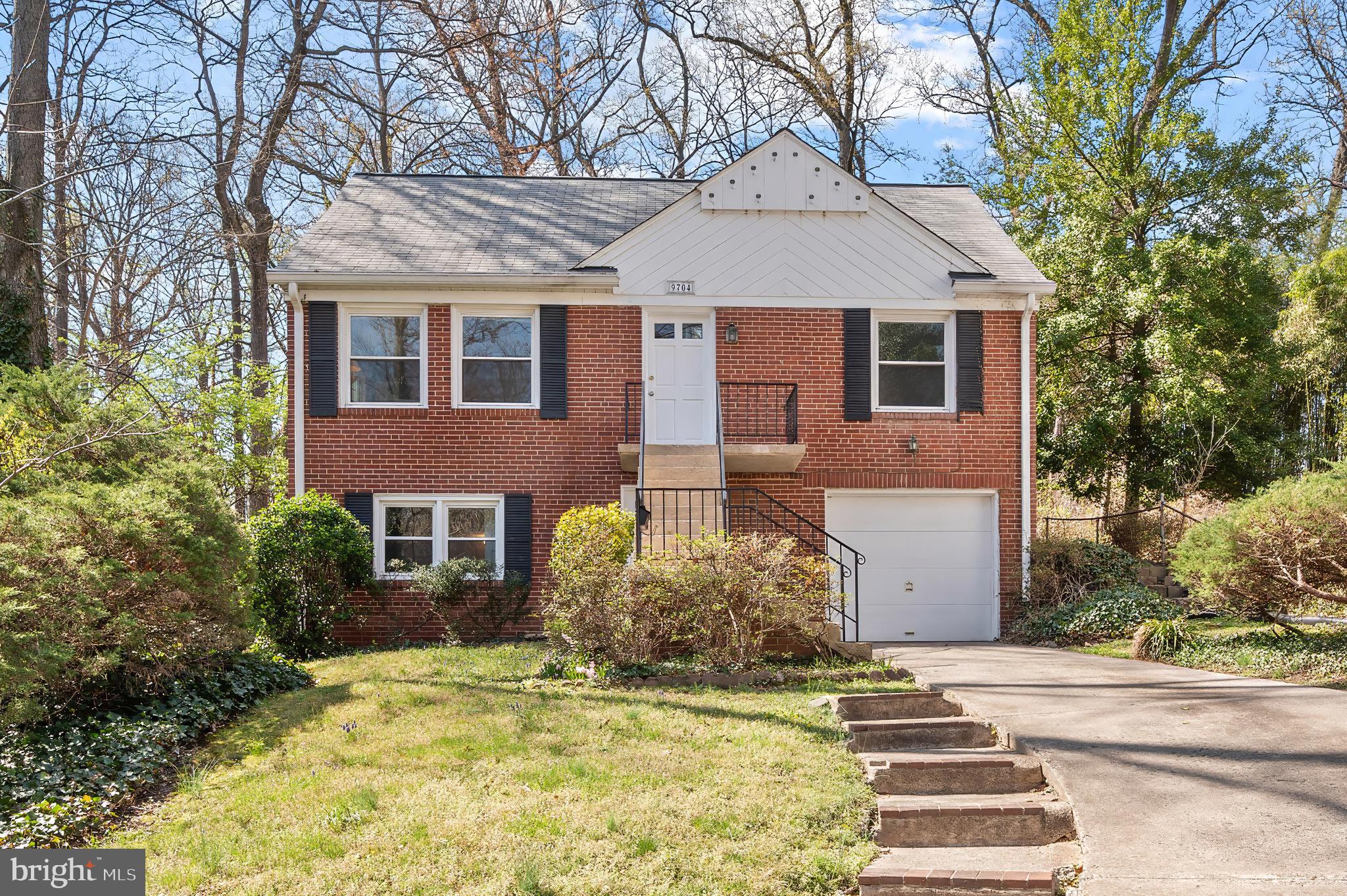 9704 Lorain Avenue Silver Spring, MD 20901 - Photo 1 of 43 a front view of a house with garden