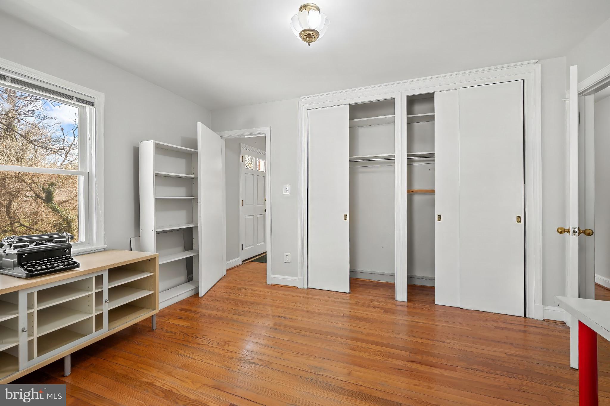 9704 Lorain Avenue Silver Spring, MD 20901 - Photo 13 of 43 a view of walk in closet with wooden floor and closet