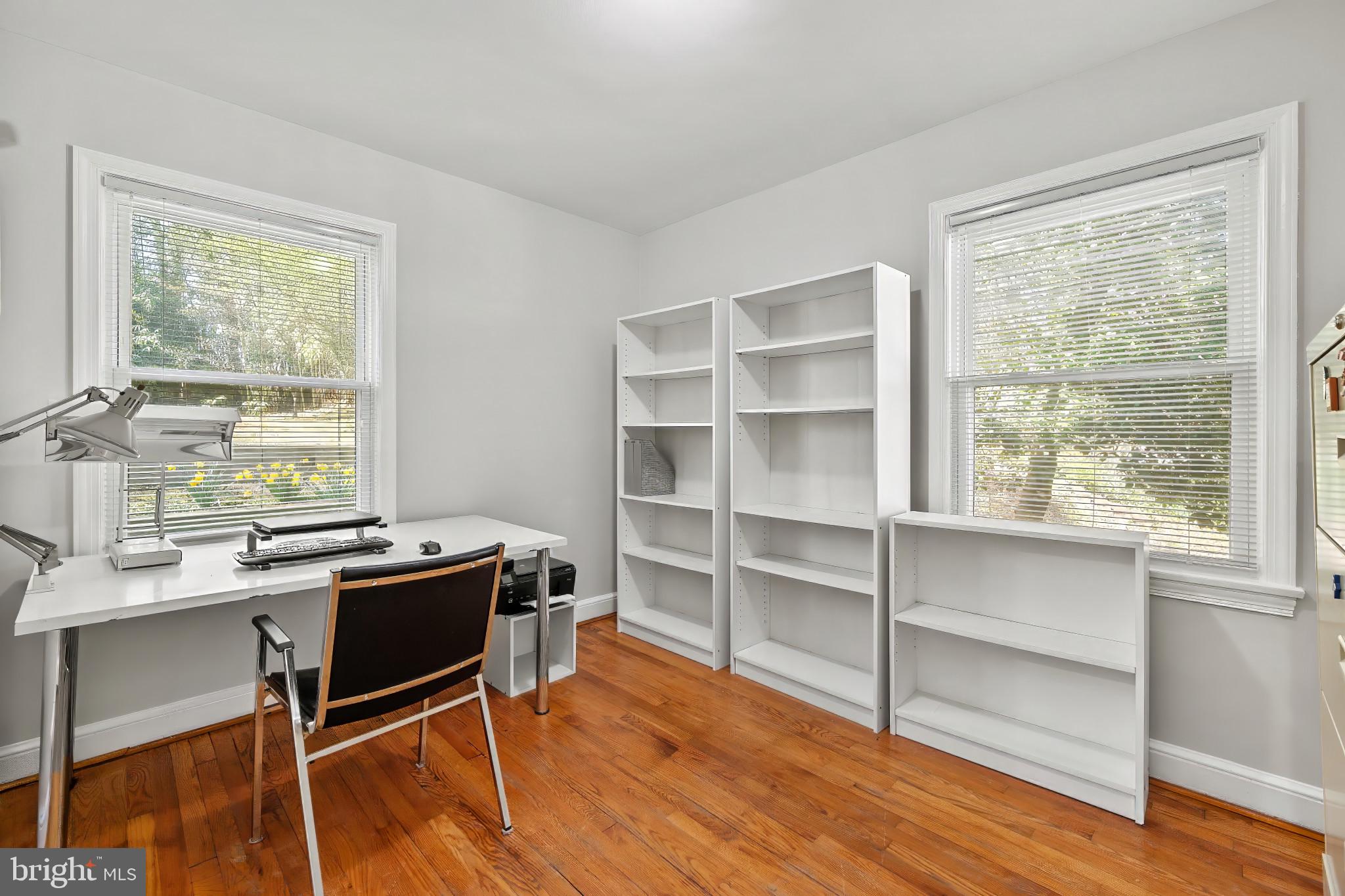 9704 Lorain Avenue Silver Spring, MD 20901 - Photo 14 of 43 a view of a workspace with furniture and a window