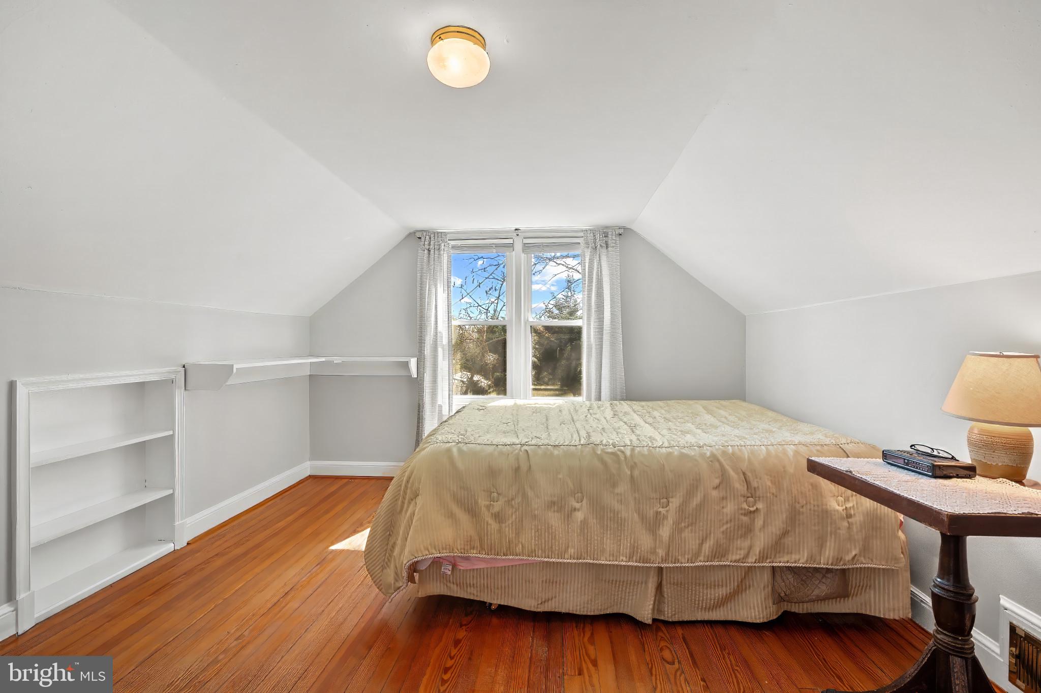 9704 Lorain Avenue Silver Spring, MD 20901 - Photo 17 of 43 a bedroom with a bed and a window
