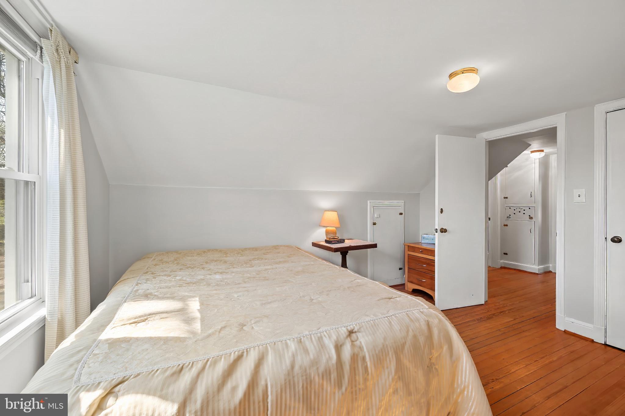 9704 Lorain Avenue Silver Spring, MD 20901 - Photo 18 of 43 a spacious bedroom with a bed and a window