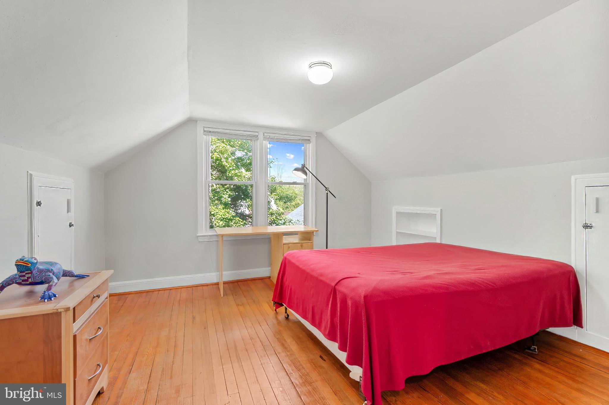 9704 Lorain Avenue Silver Spring, MD 20901 - Photo 19 of 43 a bedroom with a bed and a window