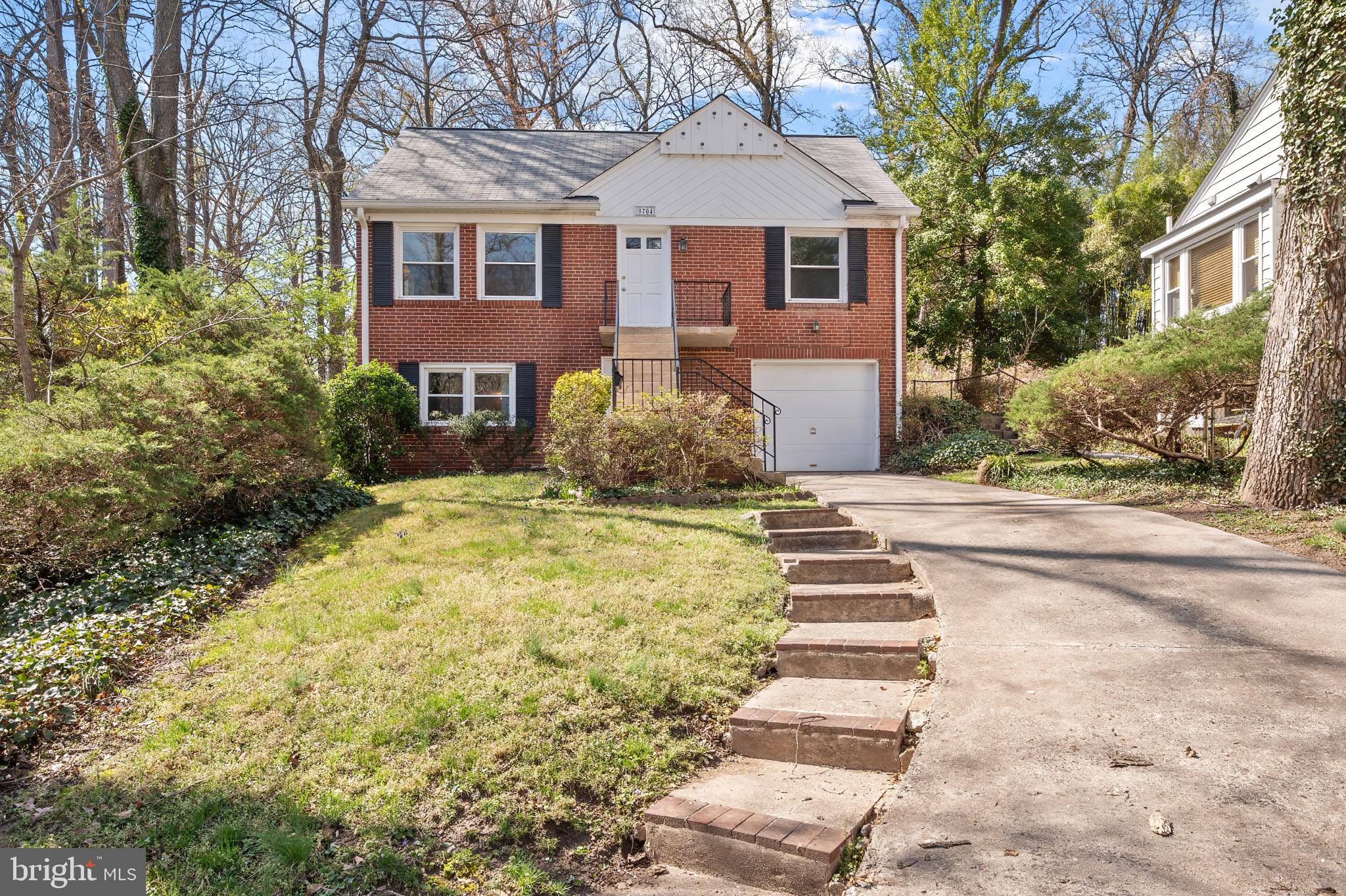 9704 Lorain Avenue Silver Spring, MD 20901 - Photo 2 of 43 a front view of a house with a yard
