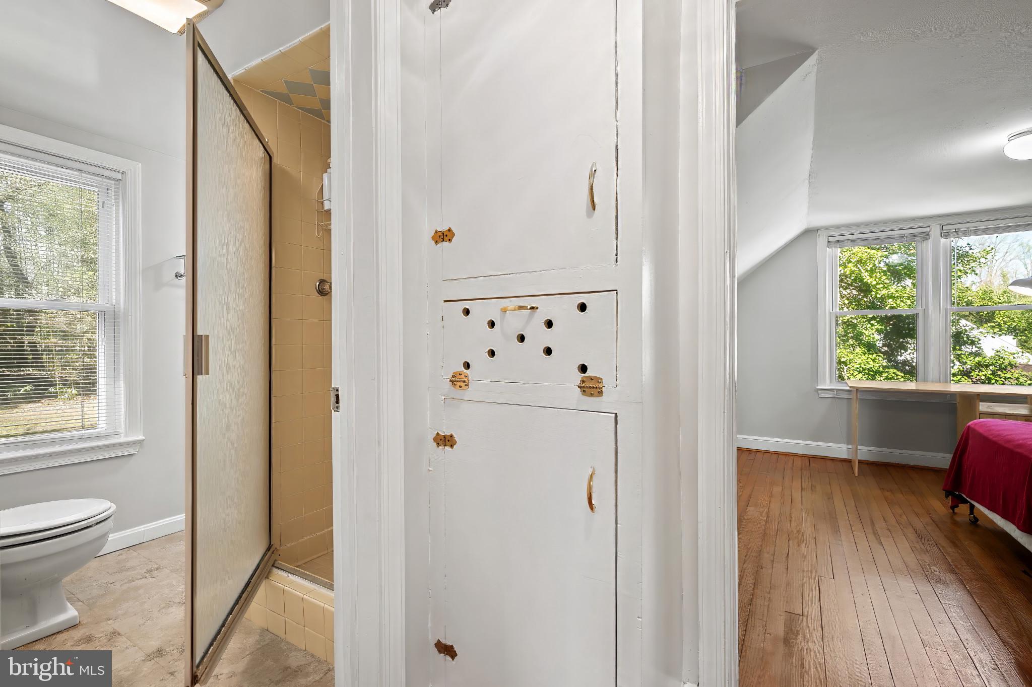 9704 Lorain Avenue Silver Spring, MD 20901 - Photo 22 of 43 a view of bathroom with a window and wooden floor