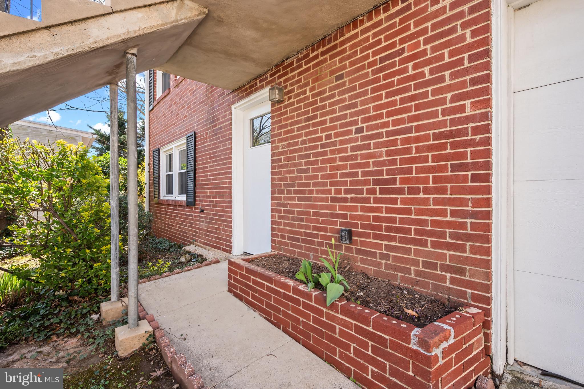 9704 Lorain Avenue Silver Spring, MD 20901 - Photo 24 of 43 a view of a backyard with chairs and a potted plant