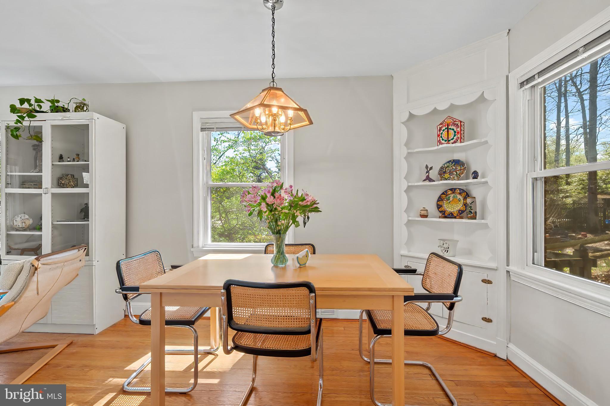 9704 Lorain Avenue Silver Spring, MD 20901 - Photo 9 of 43 a view of a dining room with furniture a chandelier and wooden floor