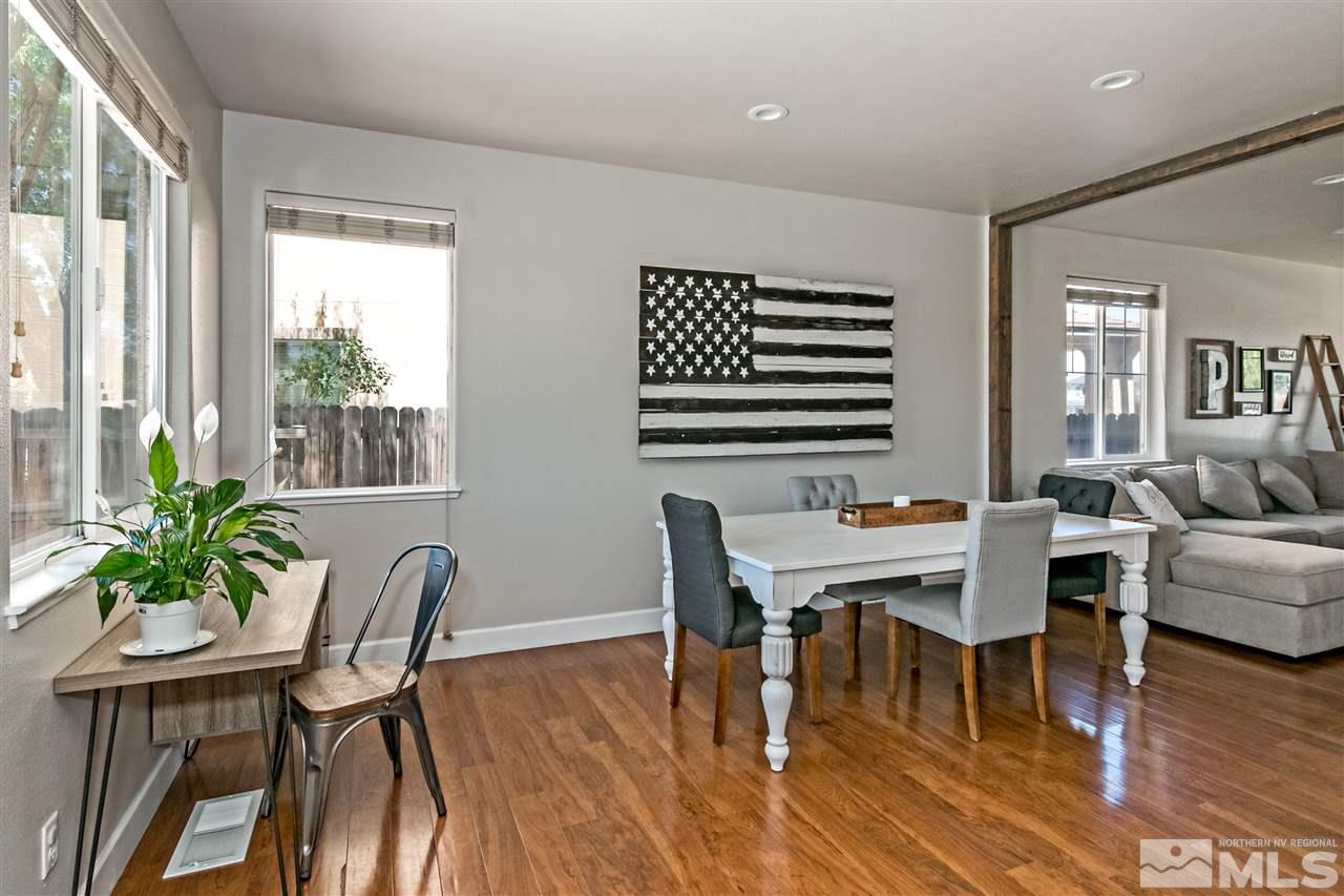 2330 Clementine Lane Reno, NV 89521 - Photo 13 of 32 a view of a dining room with furniture window and wooden floor