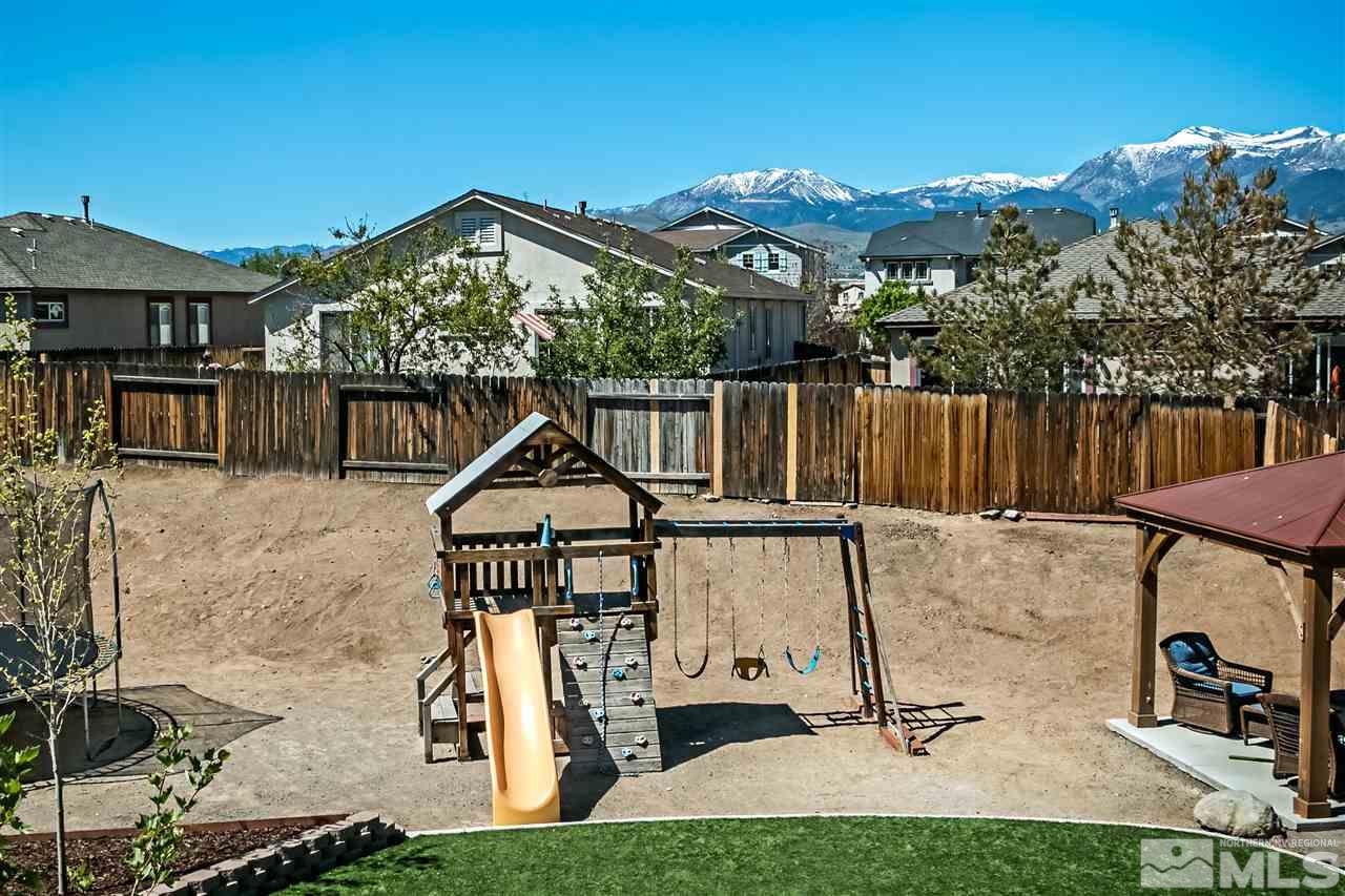 2330 Clementine Lane Reno, NV 89521 - Photo 15 of 32 a view of house with yard outdoor seating and city view
